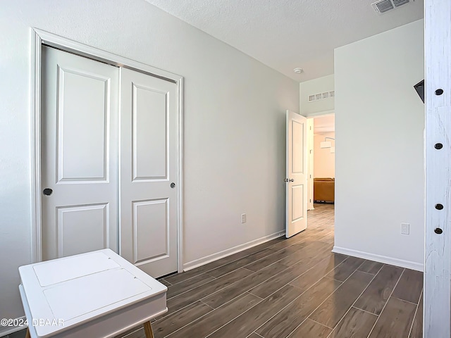 interior space featuring a textured ceiling