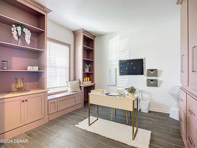 office area with a textured ceiling