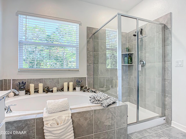 bathroom with shower with separate bathtub