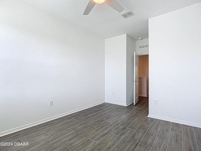 spare room with a textured ceiling and ceiling fan