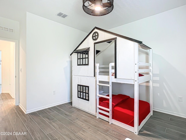 unfurnished bedroom with wood-type flooring