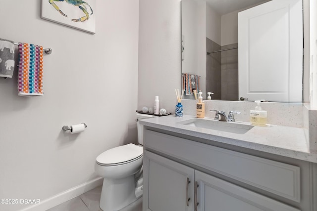 full bath featuring toilet, walk in shower, vanity, and baseboards