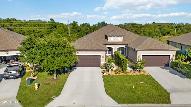 single story home with concrete driveway, a front lawn, a garage, stucco siding, and roof with shingles