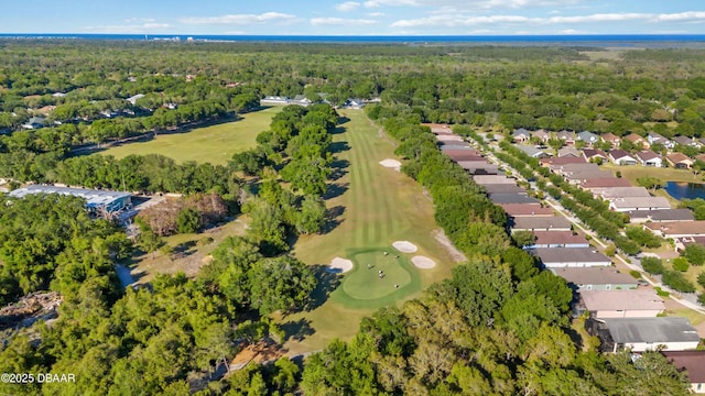 birds eye view of property featuring a residential view, a wooded view, and view of golf course