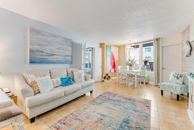 living room featuring a textured ceiling and light tile patterned floors