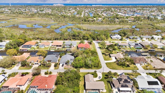 birds eye view of property with a residential view and a water view