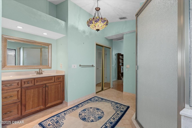 bathroom with visible vents, tile patterned flooring, and vanity