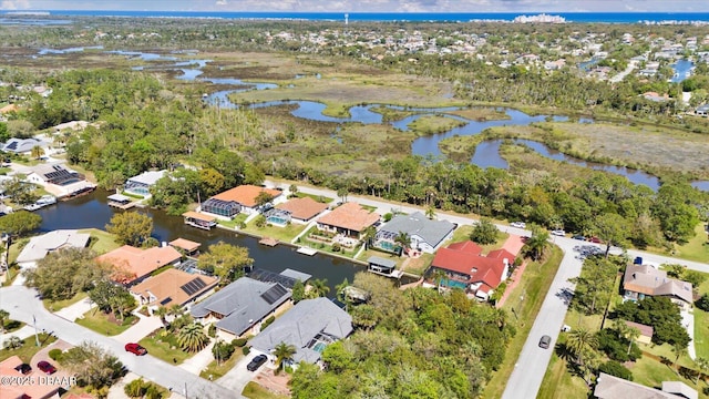 bird's eye view featuring a water view and a residential view