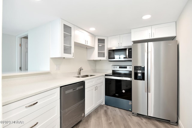 kitchen featuring white cabinetry, appliances with stainless steel finishes, and sink