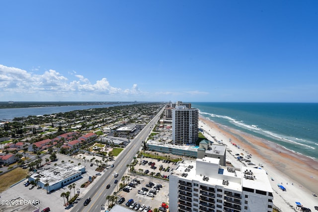 birds eye view of property featuring a view of the beach and a water view