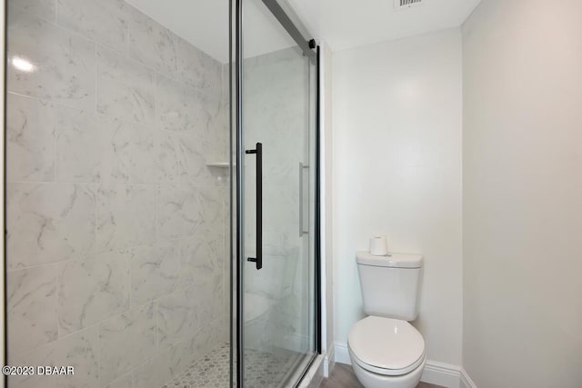 2625 S Atlantic Ave Unit 7Nw, Daytona Beach Shores, FL 32118 - full bathroom with a shower stall, toilet, and baseboards