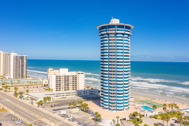 exterior space featuring a view of the beach and a water view