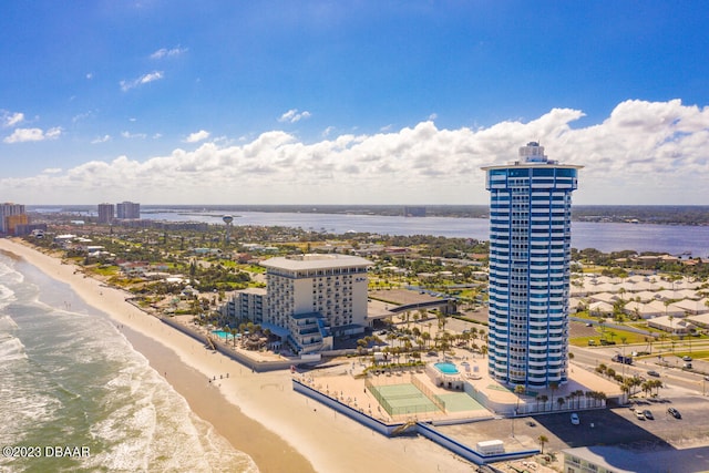 drone / aerial view featuring a view of the beach and a water view