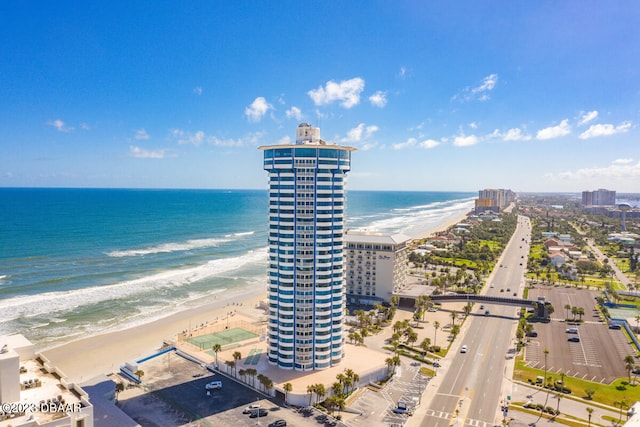 birds eye view of property with a view of the beach and a water view