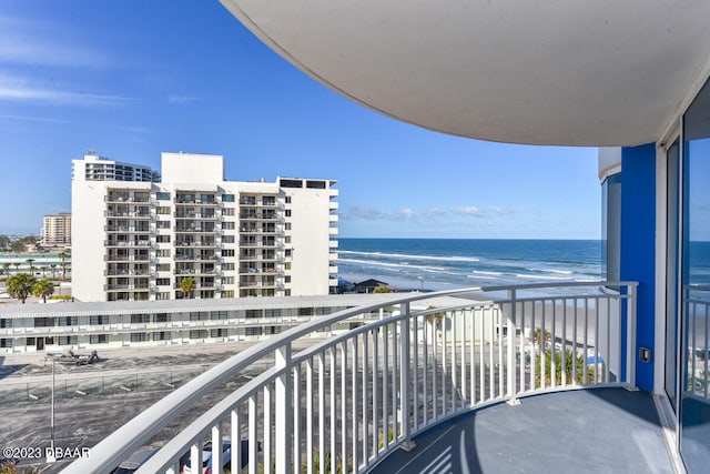 balcony with a beach view and a water view