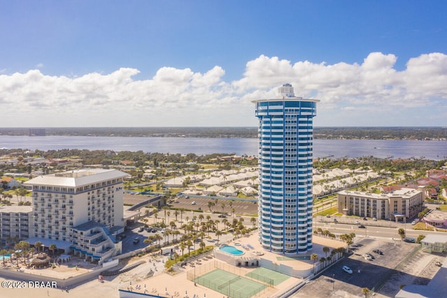 birds eye view of property with a water view