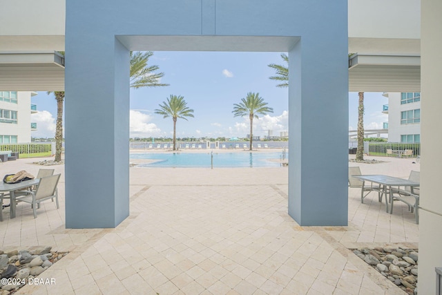 view of swimming pool with a patio area