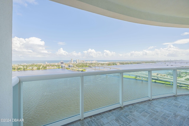 balcony featuring a water view