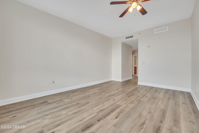 spare room featuring ceiling fan and light hardwood / wood-style flooring