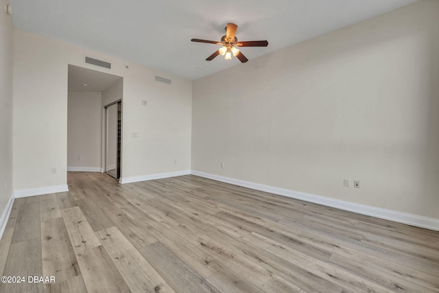 231 Riverside Dr Unit 2601-1, Daytona Beach, FL 32117 - empty room with ceiling fan, light wood-type flooring, and baseboards