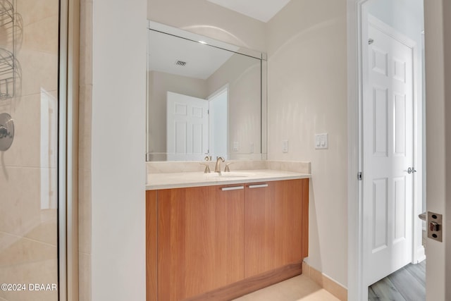 231 Riverside Dr Unit 2601-1, Daytona Beach, FL 32117 - bathroom featuring vanity and a tile shower