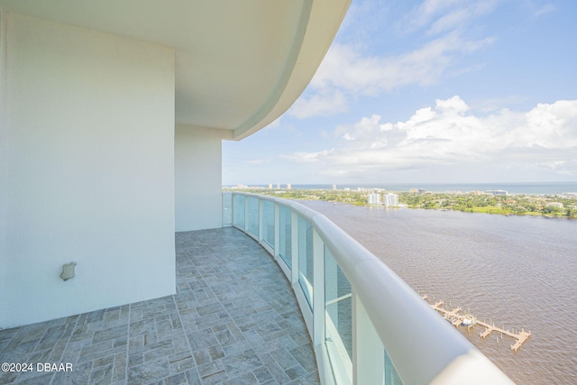 balcony featuring a water view