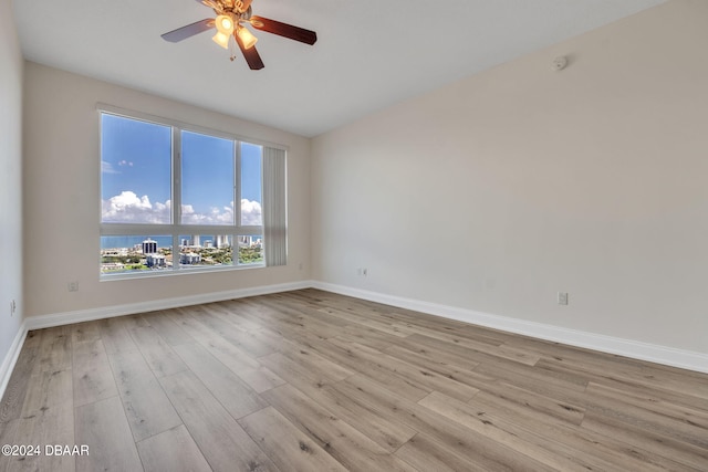 231 Riverside Dr Unit 2601-1, Daytona Beach, FL 32117 - empty room featuring wood finished floors, ceiling fan, baseboards, and lofted ceiling