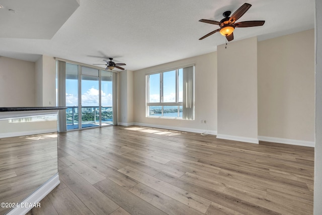 231 Riverside Dr Unit 2601-1, Daytona Beach, FL 32117 - empty room featuring ceiling fan, baseboards, and wood finished floors