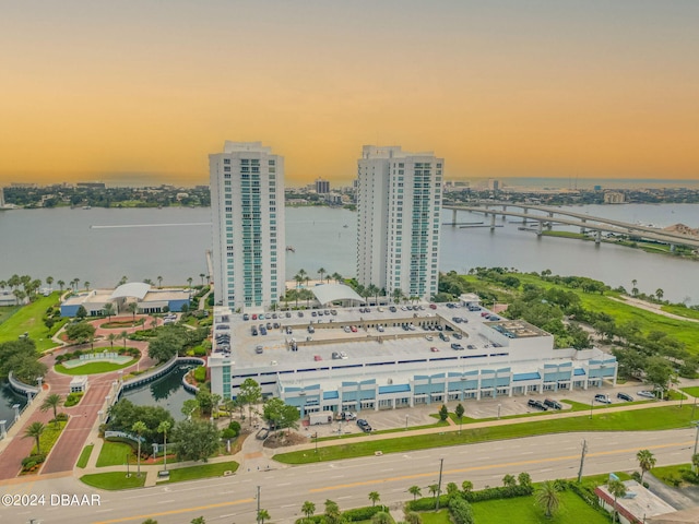 aerial view at dusk with a water view