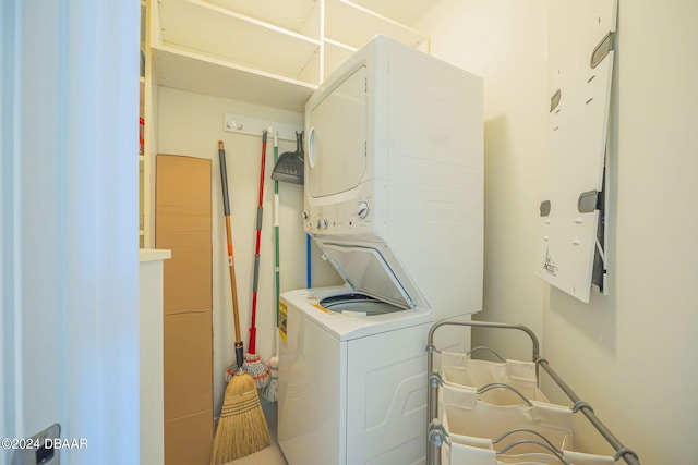 laundry area featuring stacked washer and dryer