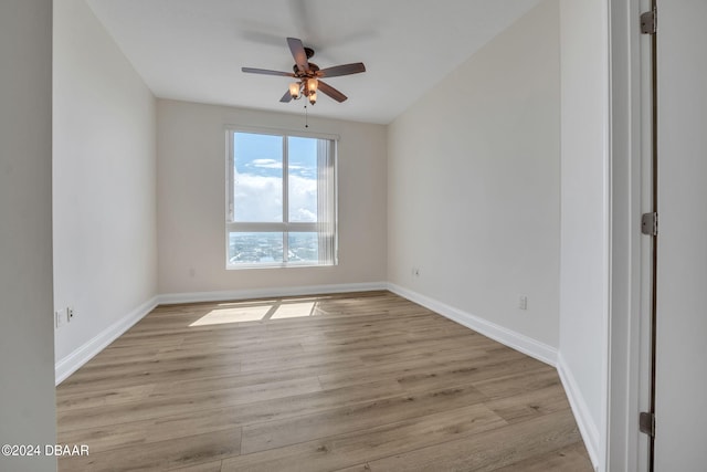 spare room with light hardwood / wood-style floors and ceiling fan