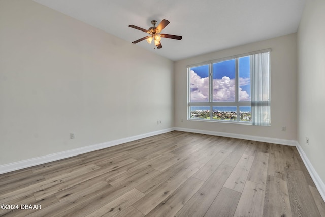 231 Riverside Dr Unit 2601-1, Daytona Beach, FL 32117 - spare room featuring ceiling fan, wood finished floors, baseboards, and vaulted ceiling