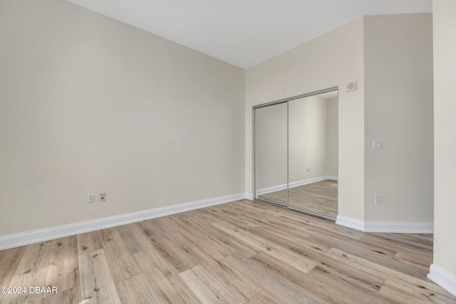 231 Riverside Dr Unit 2601-1, Daytona Beach, FL 32117 - unfurnished bedroom with light wood-style floors, baseboards, and a closet