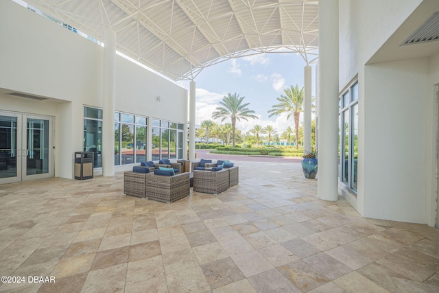 231 Riverside Dr Unit 2601-1, Daytona Beach, FL 32117 - view of patio / terrace featuring french doors and an outdoor hangout area
