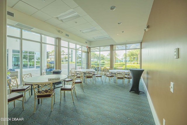 231 Riverside Dr Unit 2601-1, Daytona Beach, FL 32117 - sunroom / solarium with baseboards and a paneled ceiling