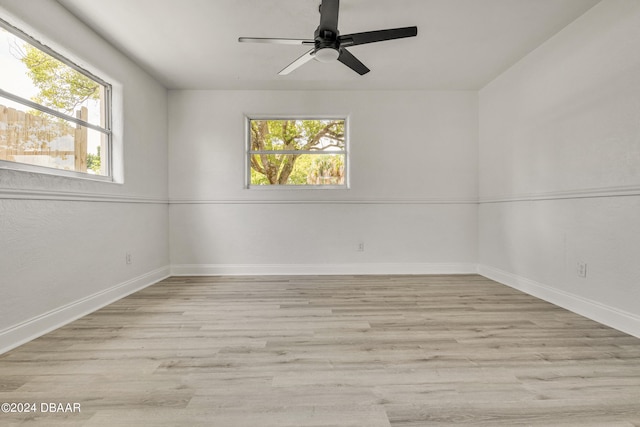 1703 Hill St, Edgewater, FL 32132 - spare room featuring ceiling fan, plenty of natural light, and light wood-type flooring