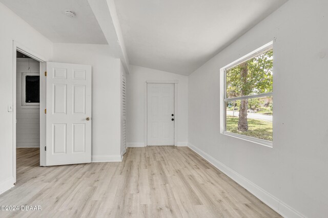 1703 Hill St, Edgewater, FL 32132 - empty room with light hardwood / wood-style flooring and vaulted ceiling