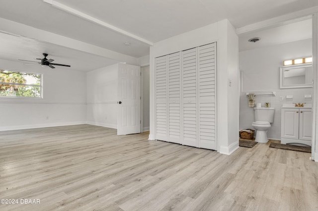 1703 Hill St, Edgewater, FL 32132 - unfurnished bedroom featuring ensuite bath, light hardwood / wood-style floors, ceiling fan, and sink