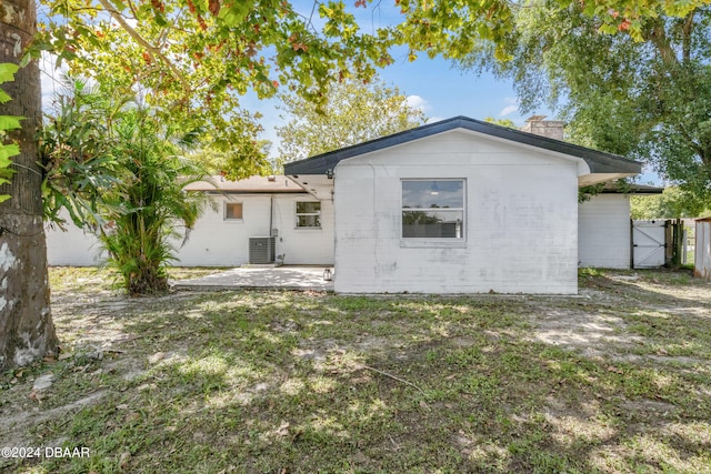 1703 Hill St, Edgewater, FL 32132 - rear view of property with a patio