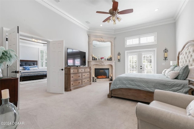 carpeted bedroom featuring access to exterior, a towering ceiling, ceiling fan, and crown molding