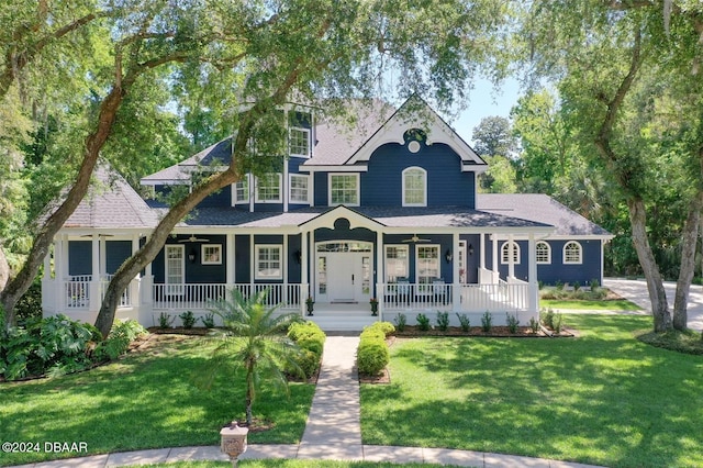 victorian-style house with covered porch and a front yard