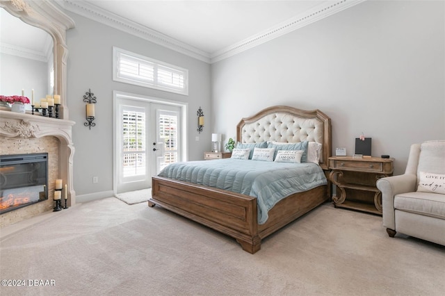 carpeted bedroom featuring access to outside, french doors, and ornamental molding