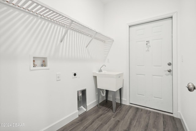 clothes washing area featuring hookup for a washing machine, dark hardwood / wood-style flooring, and hookup for an electric dryer