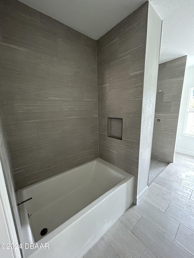 bathroom featuring separate shower and tub