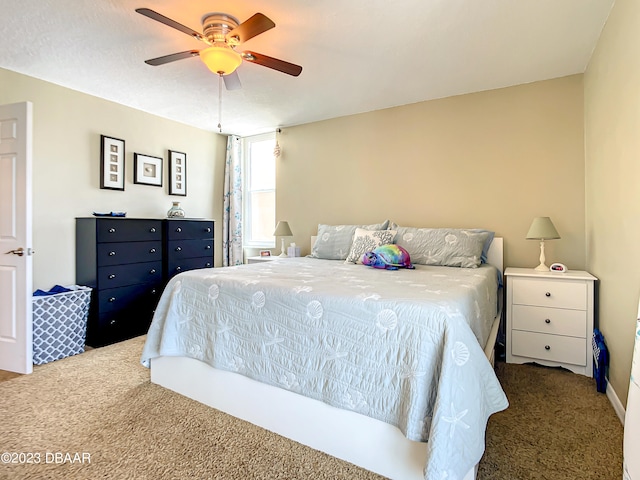 carpeted bedroom featuring ceiling fan