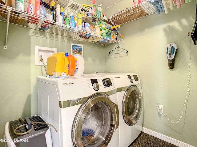 clothes washing area featuring separate washer and dryer