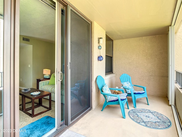 balcony featuring a baseboard heating unit