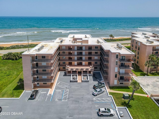 bird's eye view with a water view and a view of the beach