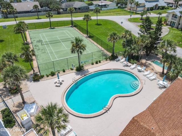 view of pool with tennis court