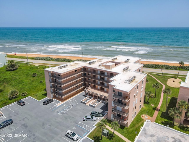 bird's eye view with a view of the beach and a water view